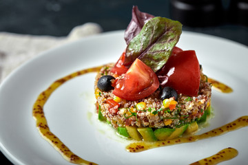 Delicious quinoa salad with avocado and tomatoes. Macro.