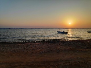 Sunset. Beach. Boat.