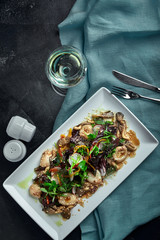 Salad of squid, mushrooms, and vegetables. The view from the top. Copy-space.