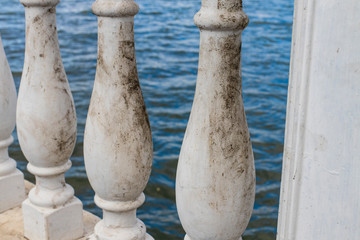 Fototapeta premium dirty marble column fence architecture element background desolate mood picture 
