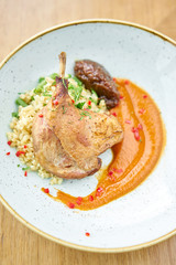 Plate Duck leg su-vide, with bulgur and onion marmalade. Barbecue restaurant menu, a series of photos of different meats