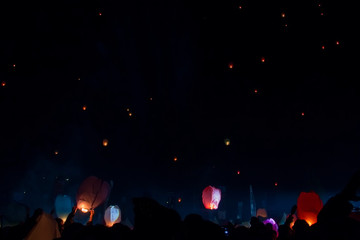 Fototapeta na wymiar A thousand lanterns fly in the beautiful sky at night