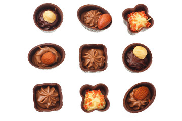 Chocolate pralines isolated on a white background. top view