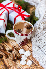 Christmas mug of hot cocoa on wooden background. Christmas mood in detail.