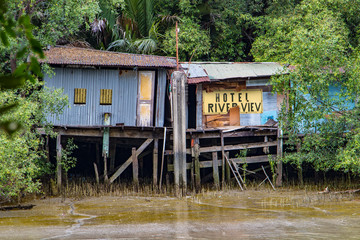 The unreal hotel on a river coast. A photo of metal shelter on the shore with in computer adjusted...