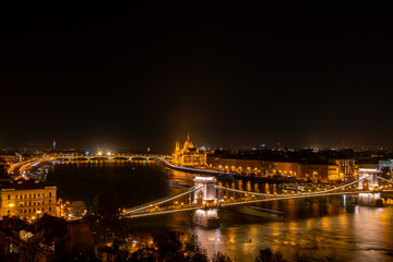 Fototapeta na wymiar Budapest nightscape, view over bridges and Parliament Building.