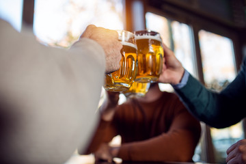 Friends drinking beer at the brewery