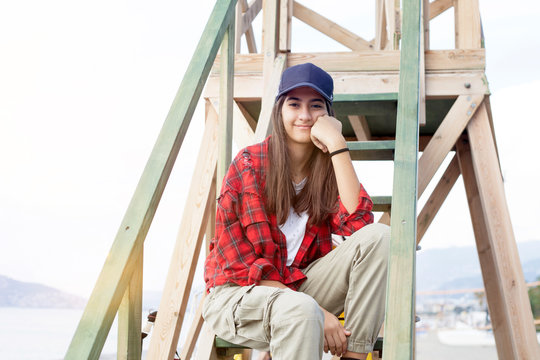 Young Woman Climbing A Ladder