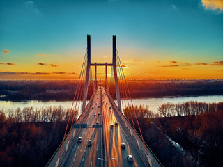 Beautiful panoramic aerial drone view to cable-stayed Siekierkowski Bridge over the Vistula river...