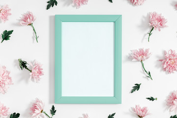 Beautiful flowers composition. Photo frame and pink flowers on white background. Valentines Day, Easter, Happy Women's Day, Mother's day. Flat lay, top view, copy space