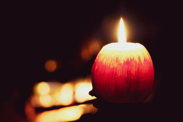 Look at how a single candle can both defy and define the darkness