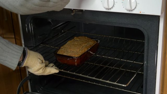 Test for doneness of banana bread and remove from oven 4K