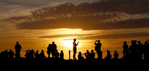 Fototapeta na wymiar silhouette of people at sunset