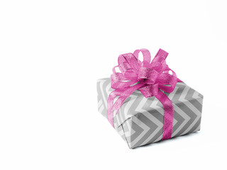 Surprise gift with a pink bow on white background. Isolate.
