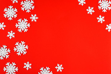 Fototapeta na wymiar Snowflakes on a bright red background. We are preparing to meet the new year 2020 and Christmas.