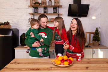 family waiting for Christmas at home in kitchen