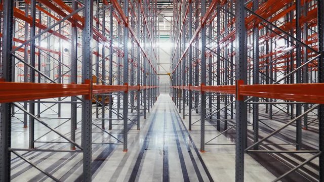 motion between metal racks in modern spacious warehouse