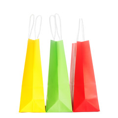 Paper colourful shopping or gift bags isolated on white background. The concept of shopping or gifts.