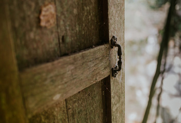 Old wooden windows in lost house in Asia