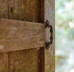 Old wooden windows in lost house in Asia