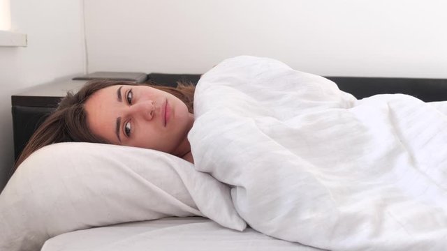 beauty women wake up from sleep and does not want to get out of bed 4k