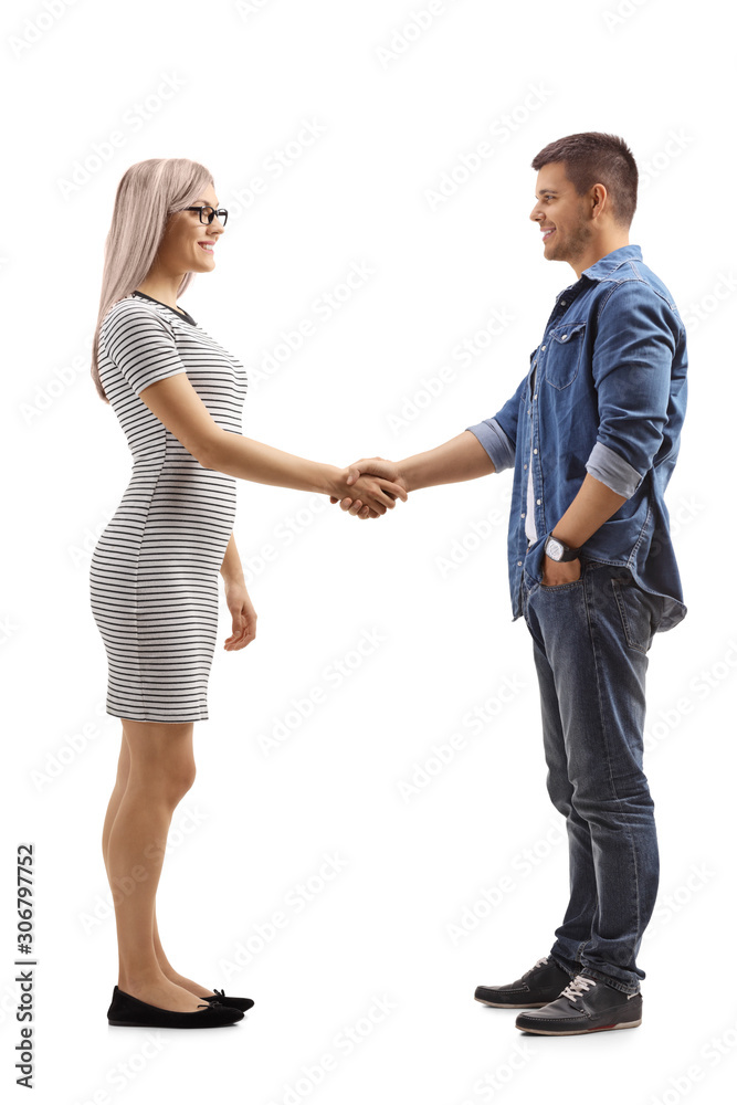 Wall mural Blond woman shaking hand with a casual young man