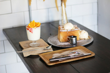 Honey Toast with whipped ice cream and yogurt orange in glass