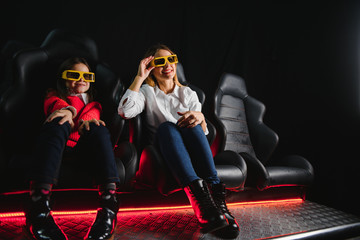 3D reality. People wearing 3D glasses screaming while watching a movie at the local cinema weekend premiere 3D technology shocked surprised scream entertainment activity concept