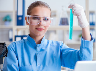 Female scientist researcher conducting an experiment in a labora