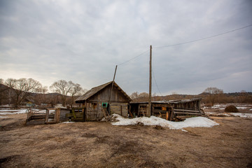 Russian village. Old wooden shed on the ground in a Russian village.