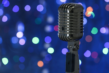 Retro microphone against defocused lights
