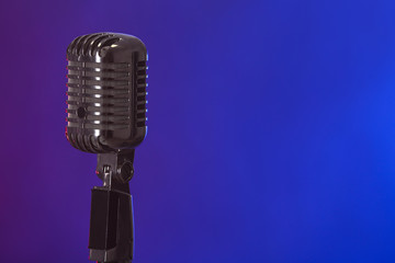 Fototapeta premium Retro microphone on dark color background