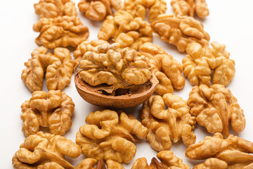 Tasty walnuts on white background, closeup