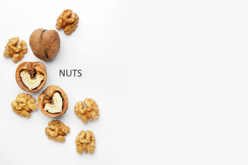 Tasty walnuts on white background