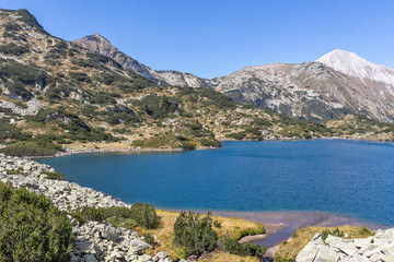 Fototapeta na wymiar Fish Banderitsa lake and Vihren Peak, Pirin Mountain, Bulgaria