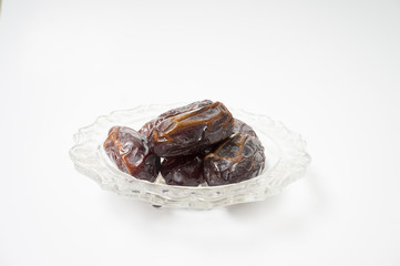 Medjoul or Medjool dates on white background