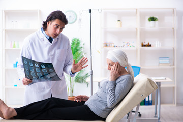 Young male doctor and female oncology patient