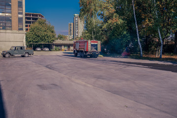 Obraz na płótnie Canvas Fire engine leaving the garage of the fire station