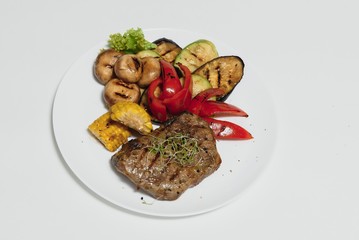 BBQ Steak. Barbecue Grilled Beef Steak Meat with Vegetables. Healthy Food. Barbeque Steak Dinner