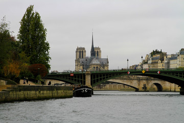 A tranquil photo taken of Notre Dame cathedral while taking a river cruise on the Seine