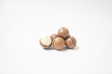 Macadamia nuts on white background.