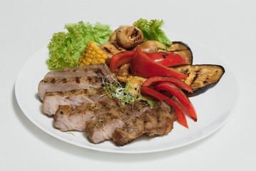 BBQ Steak. Barbecue Grilled Beef Steak Meat with Vegetables. Healthy Food. Barbeque Steak Dinner