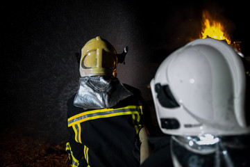 Naklejka premium Firefighters in action