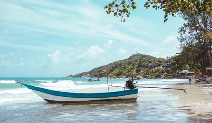 Naklejka na ściany i meble Fishing boats on the beach in Asian tropical sea