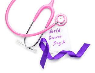 Paper with text WORLD CANCER DAY, stethoscope and purple ribbon on white background