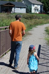 Father and daughter going for a walk