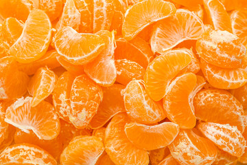 Many tangerine segments as background