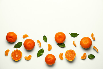 Sweet tangerines on white background