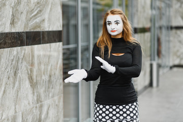 Portrait of a mime comedian. mime girl on the street
