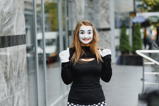 The girl with makeup of the mime. improvisation. mime shows different emotions
